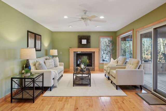 1811 Lake Lucy Ln, Chanhassen, MN 55331 - living room with hardwood / wood-style flooring, a high end fireplace, a ceiling fan, recessed lighting, and baseboards