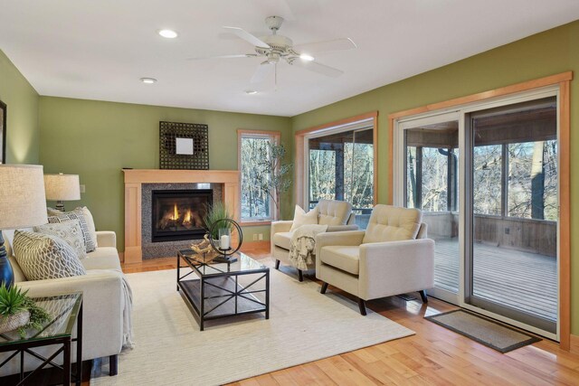 1811 Lake Lucy Ln, Chanhassen, MN 55331 - living room with a premium fireplace, light wood-style flooring, ceiling fan, and recessed lighting