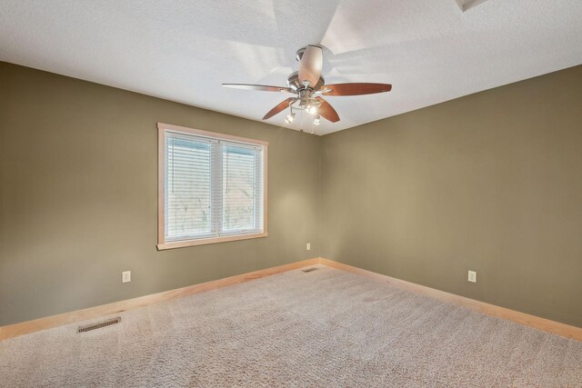 1811 Lake Lucy Ln, Chanhassen, MN 55331 - empty room featuring a ceiling fan, carpet, baseboards, and a textured ceiling