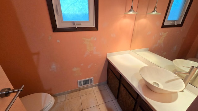 14291 92nd Ave N, Maple Grove, MN 55369 - half bath featuring tile patterned flooring, vanity, toilet, baseboards, and visible vents
