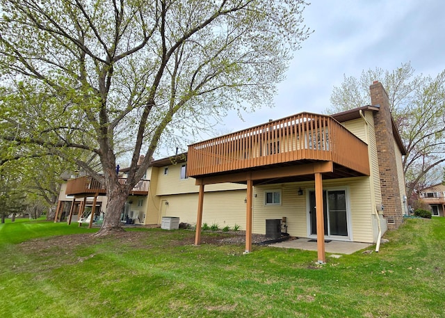 14291 92nd Ave N, Maple Grove, MN 55369 - back of house with a chimney, a yard, and a deck