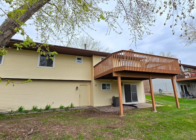 14291 92nd Ave N, Maple Grove, MN 55369 - back of house featuring a lawn, central AC, and a wooden deck