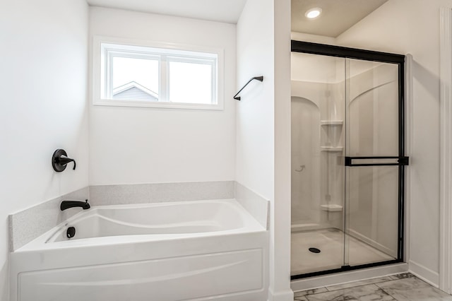 full bathroom with a shower stall, a bath, and marble finish floor