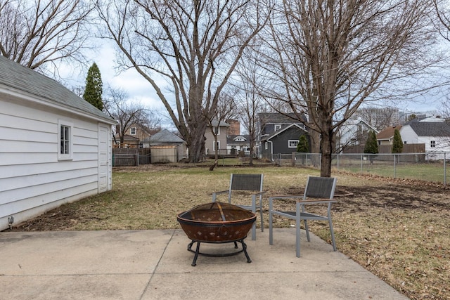 view of patio with a fenced backyard, an outdoor fire pit, and a residential view
