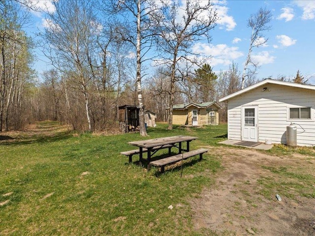 14805 300th St, Red Eye Twp, MN 56477 - view of grassy yard with an outdoor structure and a shed