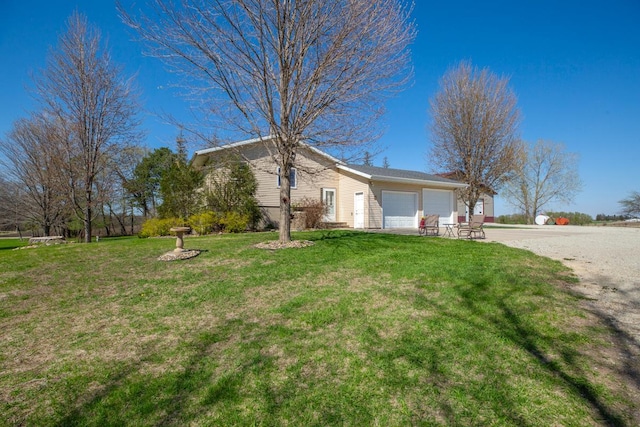 19023 Davis Ave, Faribault, MN 55021 - view of front of property featuring a front lawn, driveway, and a garage