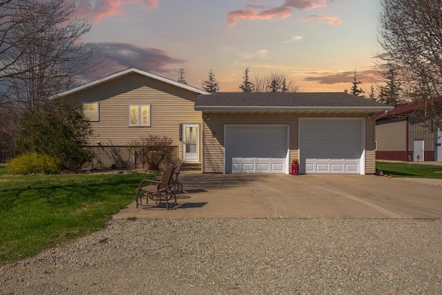 19023 Davis Ave, Faribault, MN 55021 - view of front of property featuring an attached garage, a lawn, and gravel driveway