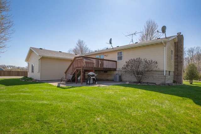 19023 Davis Ave, Faribault, MN 55021 - rear view of house with a yard, a patio area, a chimney, and a deck
