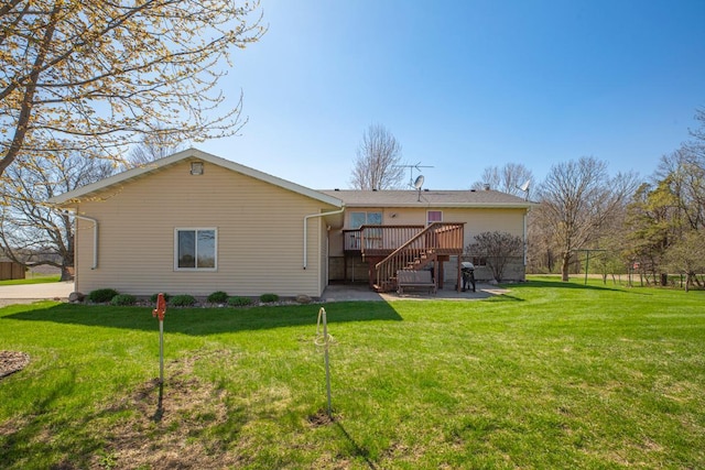 19023 Davis Ave, Faribault, MN 55021 - rear view of house with a lawn, stairs, a patio, and a deck