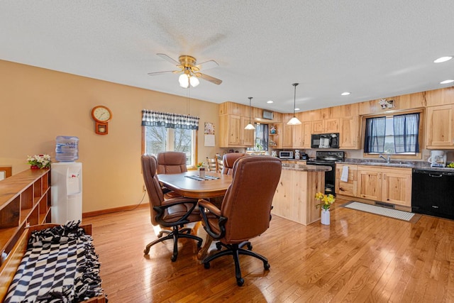 19023 Davis Ave, Faribault, MN 55021 - dining area featuring light wood-style flooring, a ceiling fan, a textured ceiling, baseboards, and recessed lighting