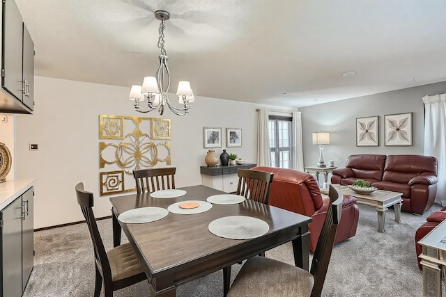 2495 Canabury Dr Unit 220, Little Canada, MN 55117 - dining area featuring a chandelier and light carpet