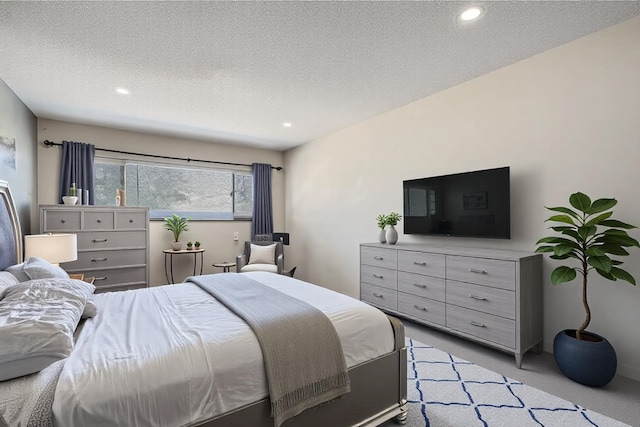 2495 Canabury Dr Unit 220, Little Canada, MN 55117 - bedroom featuring recessed lighting, a textured ceiling, and light carpet