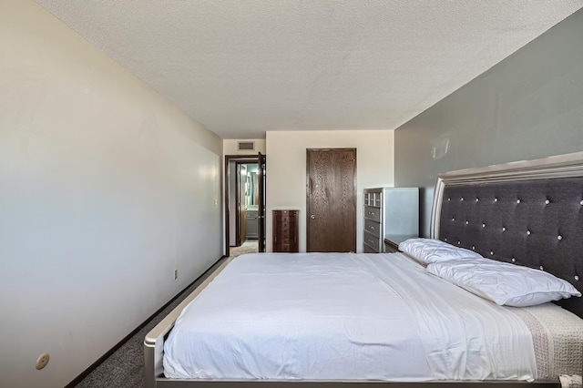2495 Canabury Dr Unit 220, Little Canada, MN 55117 - bedroom with a textured ceiling, visible vents, and light carpet