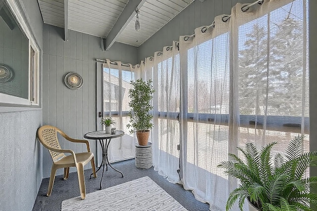 2495 Canabury Dr Unit 220, Little Canada, MN 55117 - sunroom featuring beamed ceiling, carpet, and wood walls