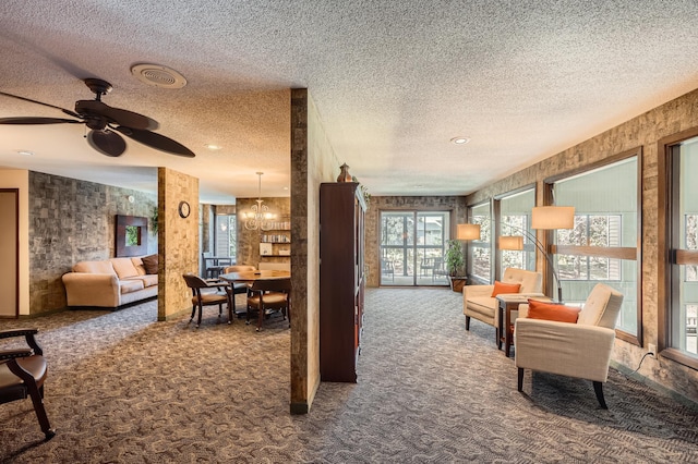 2495 Canabury Dr Unit 220, Little Canada, MN 55117 - carpeted living area with a textured ceiling, visible vents, and ceiling fan with notable chandelier