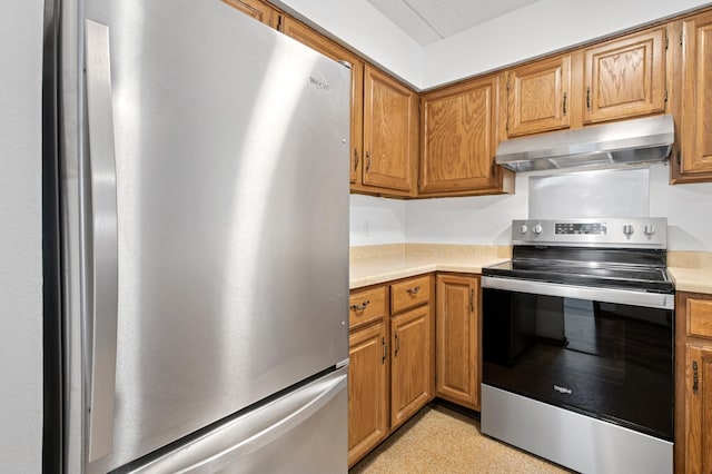 3300 Louisiana Ave S Unit 523, Saint Louis Park, MN 55426 - kitchen with appliances with stainless steel finishes, under cabinet range hood, light countertops, and brown cabinetry