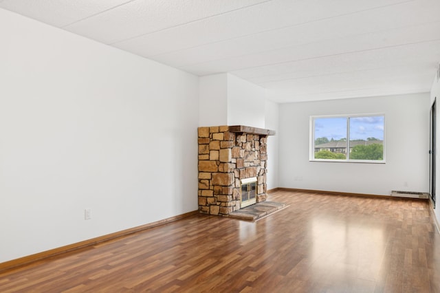 3300 Louisiana Ave S Unit 523, Saint Louis Park, MN 55426 - unfurnished living room featuring wood finished floors and a stone fireplace