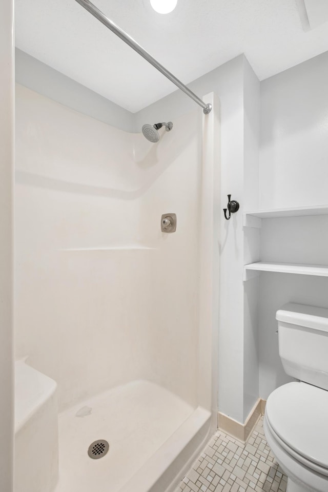 3300 Louisiana Ave S Unit 523, Saint Louis Park, MN 55426 - bathroom featuring a stall shower and toilet
