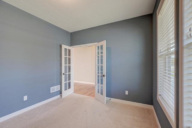 4764 Ashton Curv, Woodbury, MN 55129 - carpeted empty room featuring french doors and baseboards