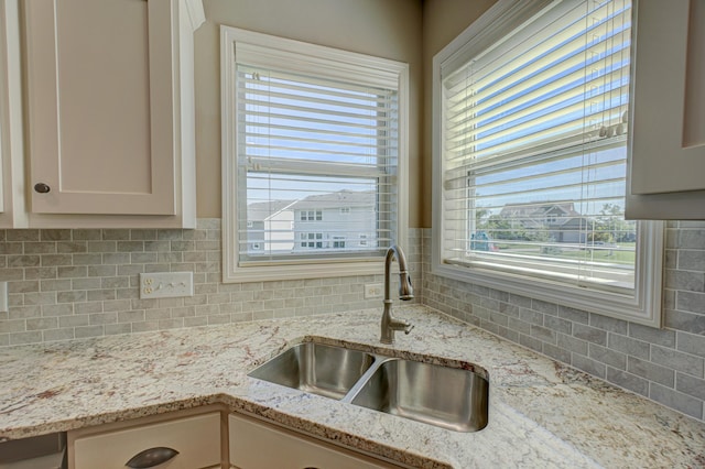 4764 Ashton Curv, Woodbury, MN 55129 - kitchen with decorative backsplash and light stone counters