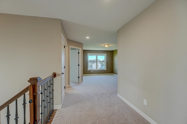 4764 Ashton Curv, Woodbury, MN 55129 - hallway featuring light colored carpet, an upstairs landing, and recessed lighting