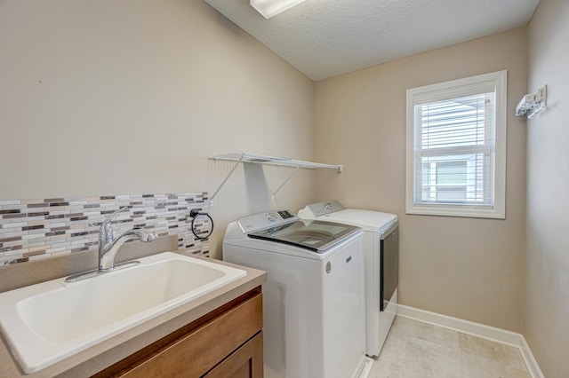 4764 Ashton Curv, Woodbury, MN 55129 - laundry area featuring washer and dryer and a textured ceiling