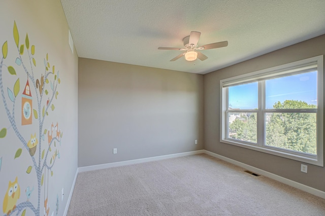 4764 Ashton Curv, Woodbury, MN 55129 - unfurnished room featuring light carpet, a textured ceiling, and a ceiling fan