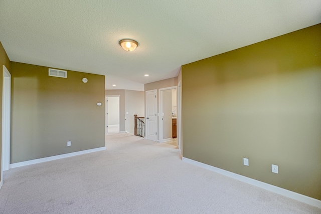 4764 Ashton Curv, Woodbury, MN 55129 - empty room featuring light colored carpet, a textured ceiling, and recessed lighting
