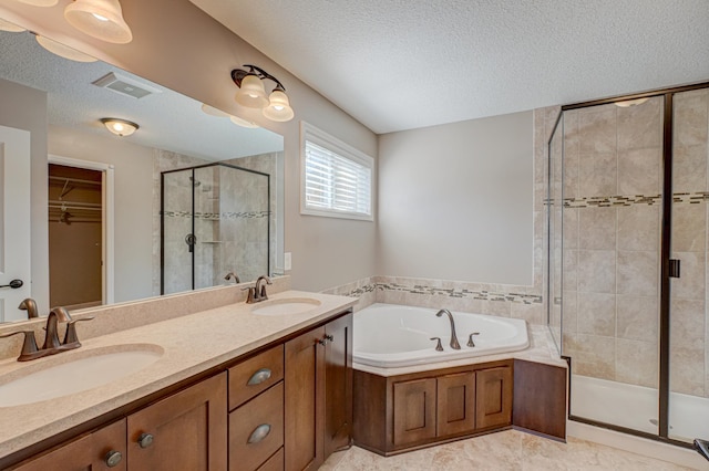4764 Ashton Curv, Woodbury, MN 55129 - bathroom with a shower stall, a textured ceiling, a garden tub, double vanity, and a spacious closet