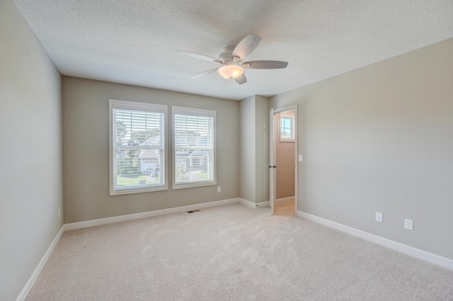 4764 Ashton Curv, Woodbury, MN 55129 - empty room featuring a ceiling fan, a textured ceiling, and light colored carpet