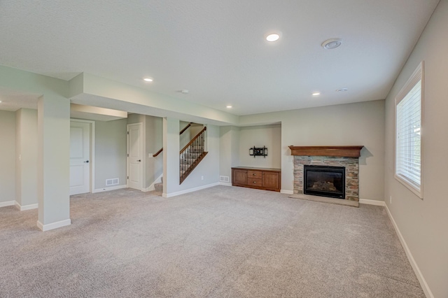 4764 Ashton Curv, Woodbury, MN 55129 - unfurnished living room featuring light carpet, recessed lighting, stairs, and a fireplace