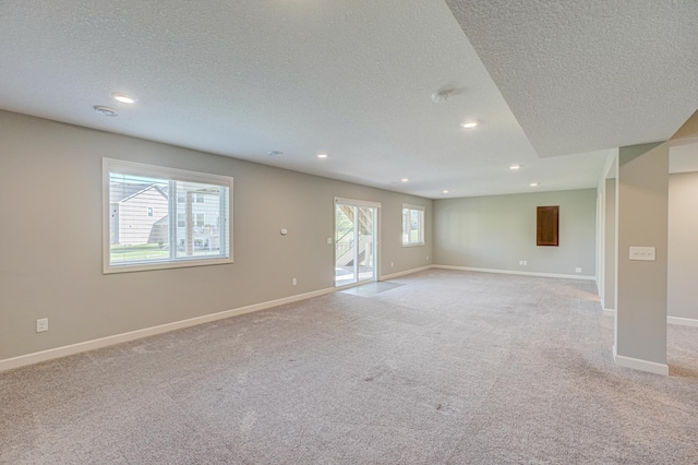 4764 Ashton Curv, Woodbury, MN 55129 - unfurnished room with a textured ceiling, light colored carpet, and recessed lighting