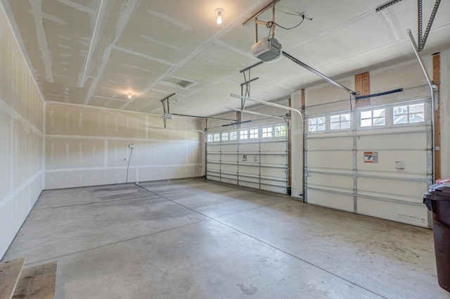 4764 Ashton Curv, Woodbury, MN 55129 - garage featuring a garage door opener