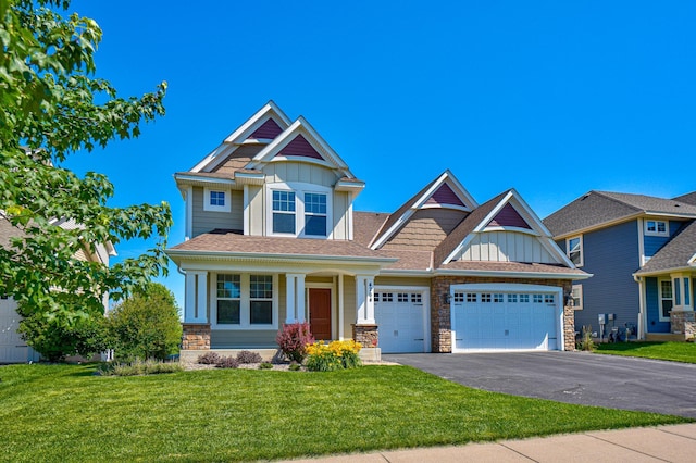 4764 Ashton Curv, Woodbury, MN 55129 - craftsman inspired home featuring board and batten siding, an attached garage, asphalt driveway, a front yard, and stone siding