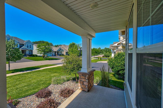 4764 Ashton Curv, Woodbury, MN 55129 - covered porch with a residential view and a yard