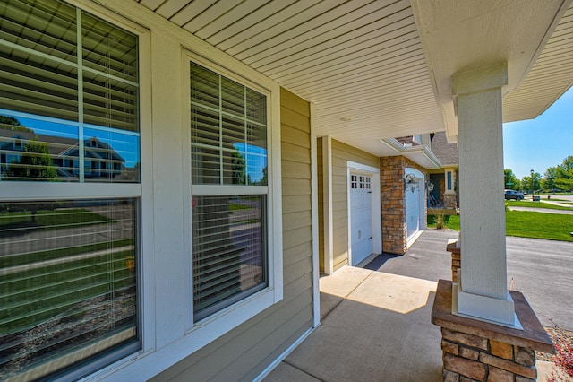 4764 Ashton Curv, Woodbury, MN 55129 - porch featuring an attached garage