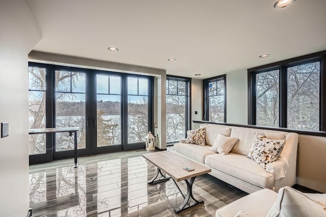 living area featuring recessed lighting and french doors