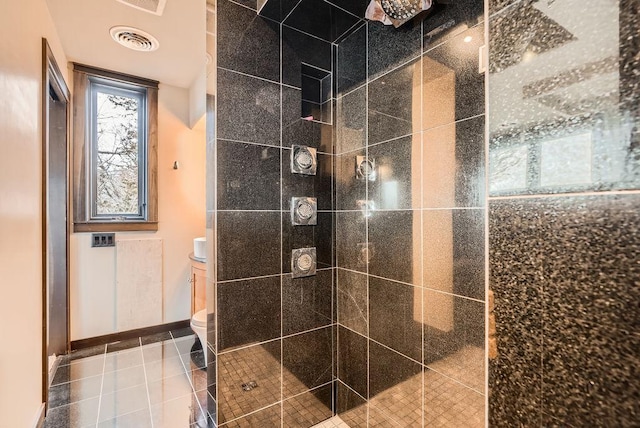 full bath with visible vents, baseboards, toilet, tile patterned floors, and a stall shower