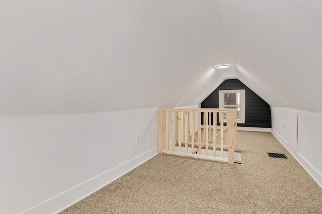 bonus room with visible vents, carpet flooring, baseboards, and vaulted ceiling