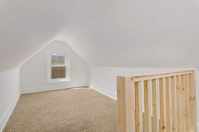 bonus room with baseboards, carpet, and lofted ceiling