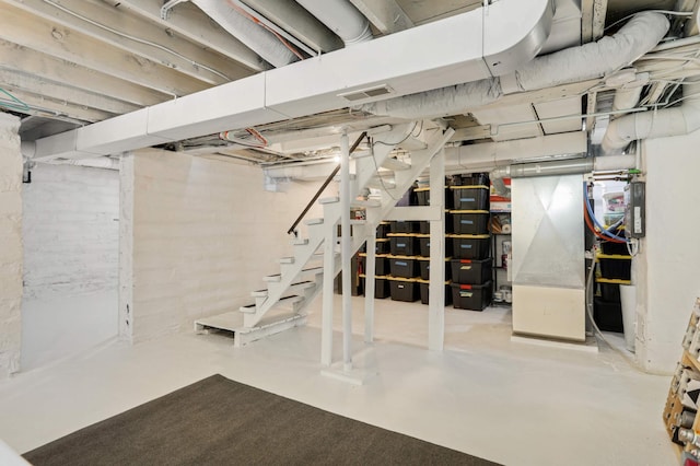 unfinished below grade area featuring stairs and visible vents