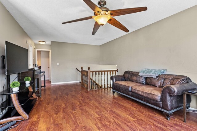 living room with ceiling fan and wood finished floors