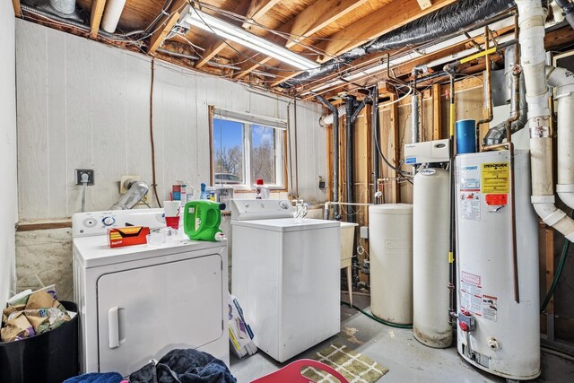 laundry area featuring washer and dryer, laundry area, and gas water heater