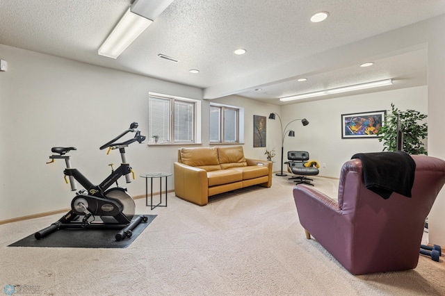 carpeted living room featuring baseboards, a textured ceiling, visible vents, and recessed lighting