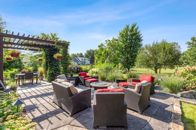 view of patio / terrace with outdoor dining area, an outdoor living space with a fire pit, and a pergola