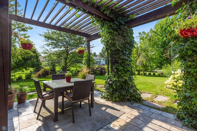 view of patio / terrace with outdoor dining area, fence, and a pergola