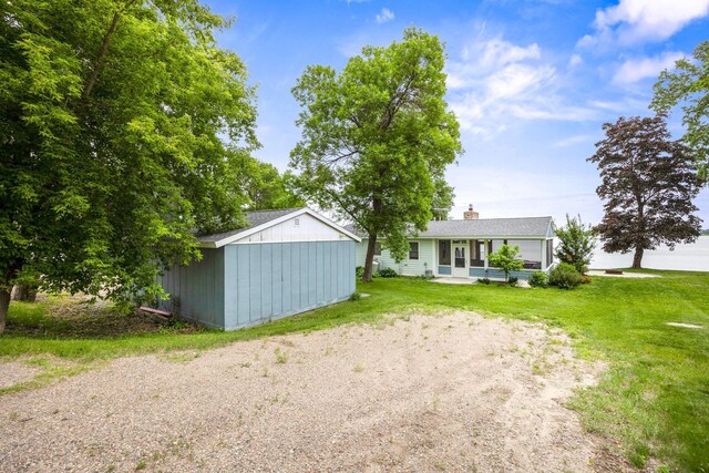 21370 654th Ave, Darwin, MN 55324 - back of property featuring a lawn and a chimney