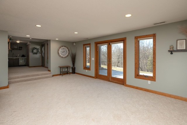 32337 Juniper Rd, Chatfield, MN 55923 - spare room featuring light carpet, recessed lighting, baseboards, and french doors