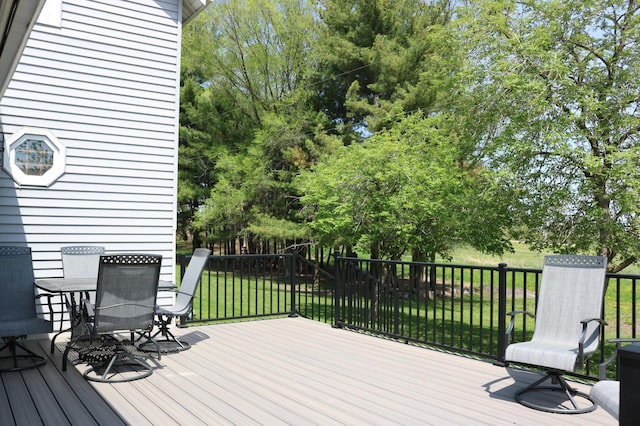 6200 37th St W, Webster, MN 55088 - deck featuring outdoor dining space, a yard, and view of scattered trees