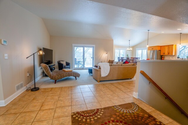 122 Ridge Rd, New London, MN 56273 - living area featuring lofted ceiling, light tile patterned floors, light carpet, baseboards, and a textured ceiling